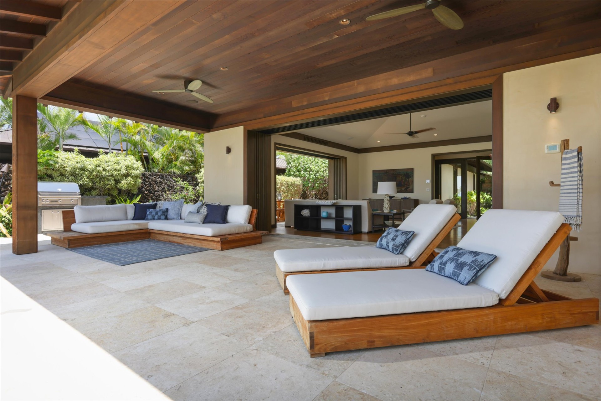 Outdoor lanai with daybed and chaise lounges