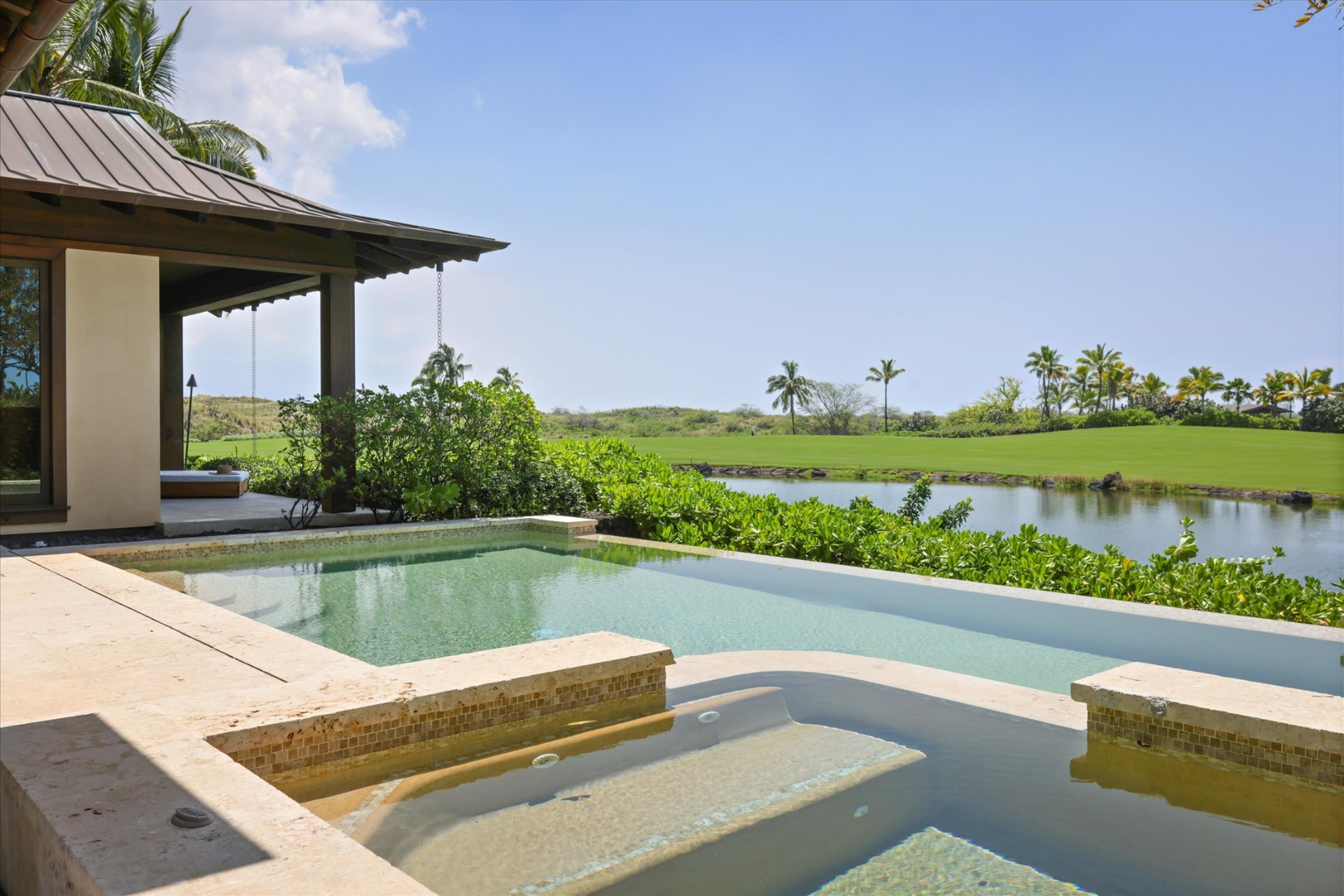 Spa overlooking water feature and fairway